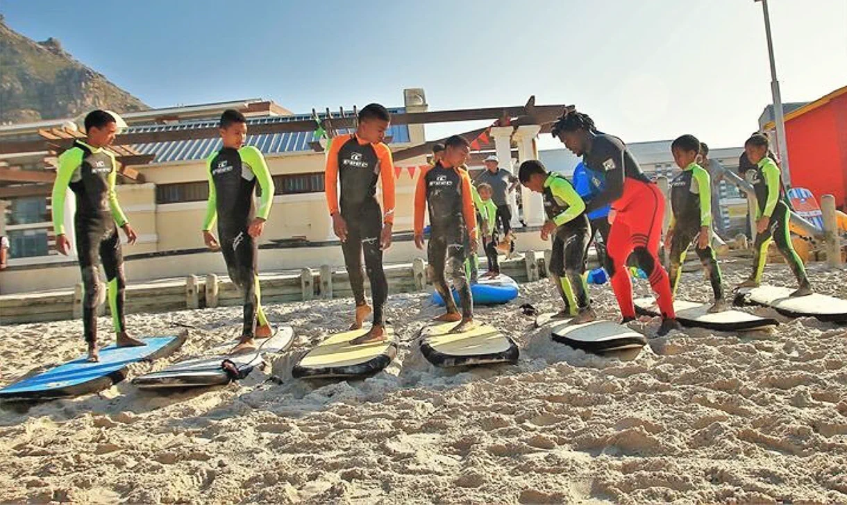 Kids practising pop-ups on the sand